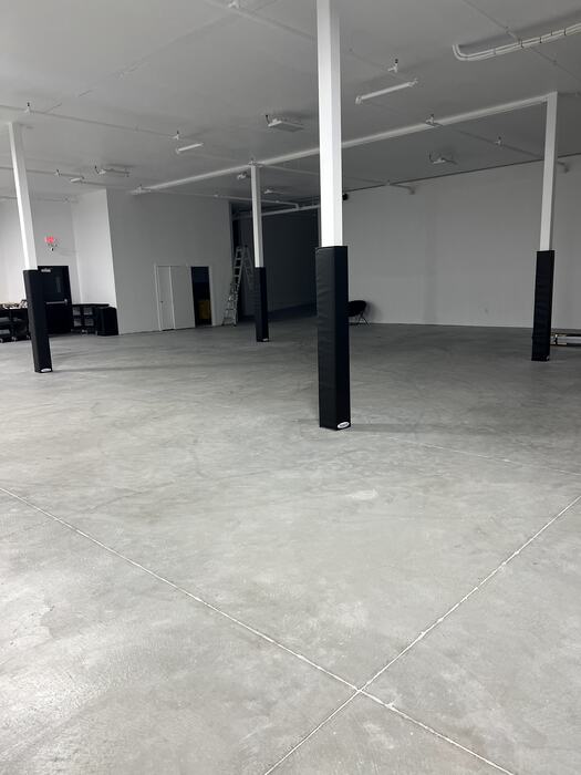 The Life Shop building before fit-out: bare concrete and empty walls