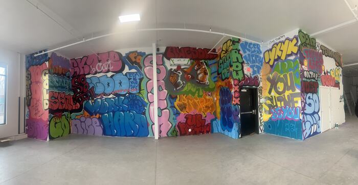 A panorama of the full Life Shop graffiti room