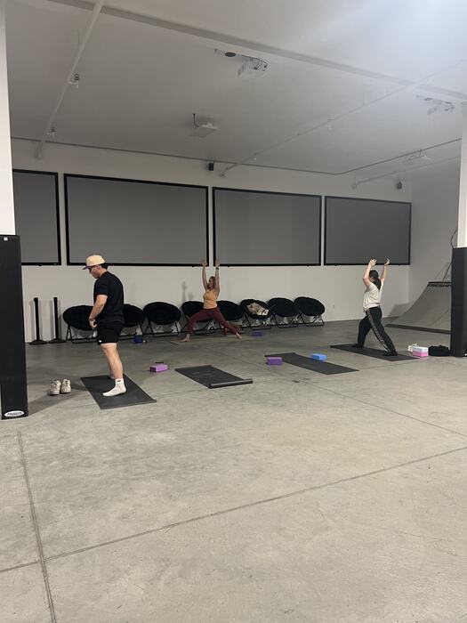A yoga class laid out on mats in the main room